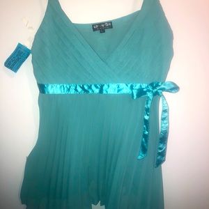 Pleated baby doll style tank with ribbon tie.